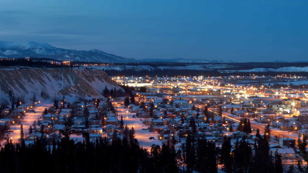 Streetlights of downtown Whitehorse, capital of the Yukon Territory, Canada, at dusk in winter.
