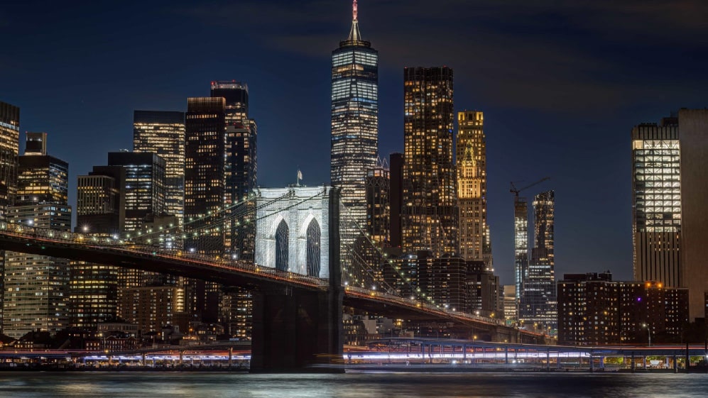 The Brooklyn Bridge and the skyline of Lower Manhattan, New York, at night