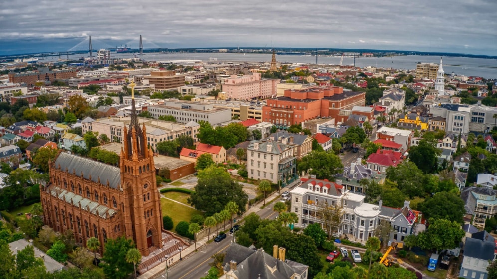 A beautiful aerial view of Charleston with dense buildings under a cloudy sky in South Carolina