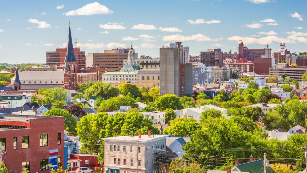 Portland, Maine, USA downtown city skyline at dusk.