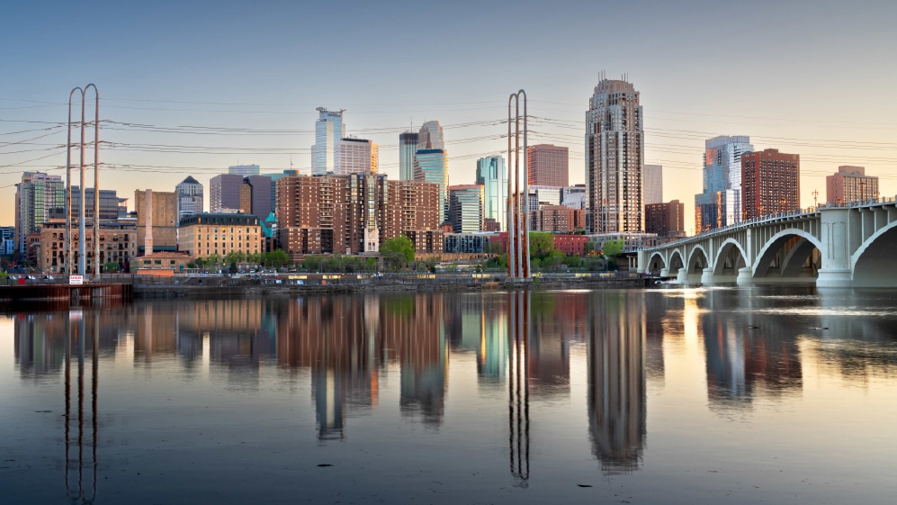 Minneapolis, Minnesota, USA downtown city skyline on the Mississippi at dusk.